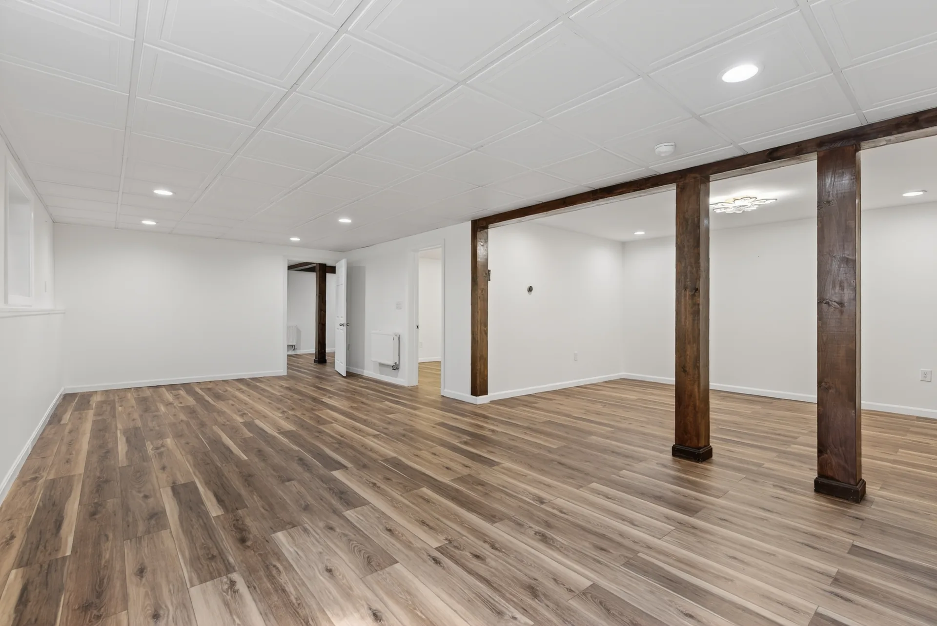 Lower-level rec room with exposed beams