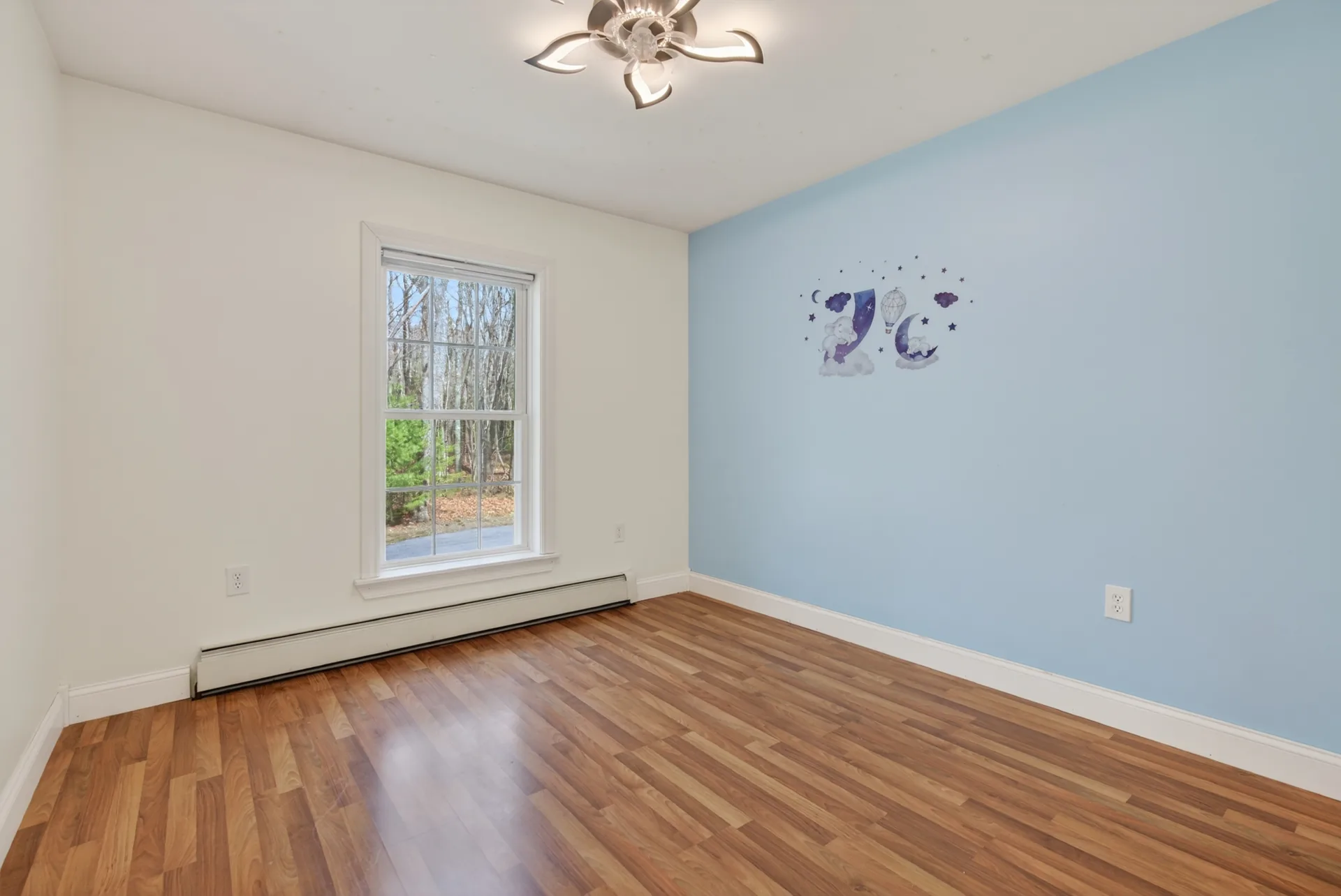 Bedroom with blue accent wall
