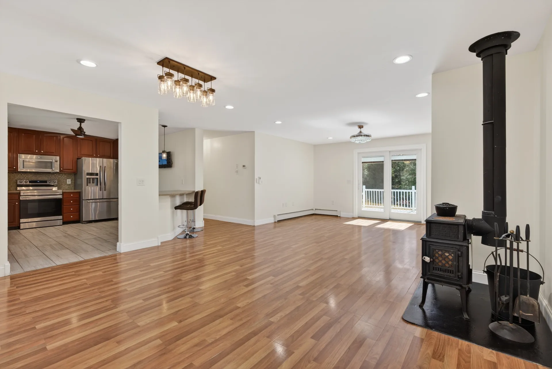 Great room wide view to kitchen and deck slider