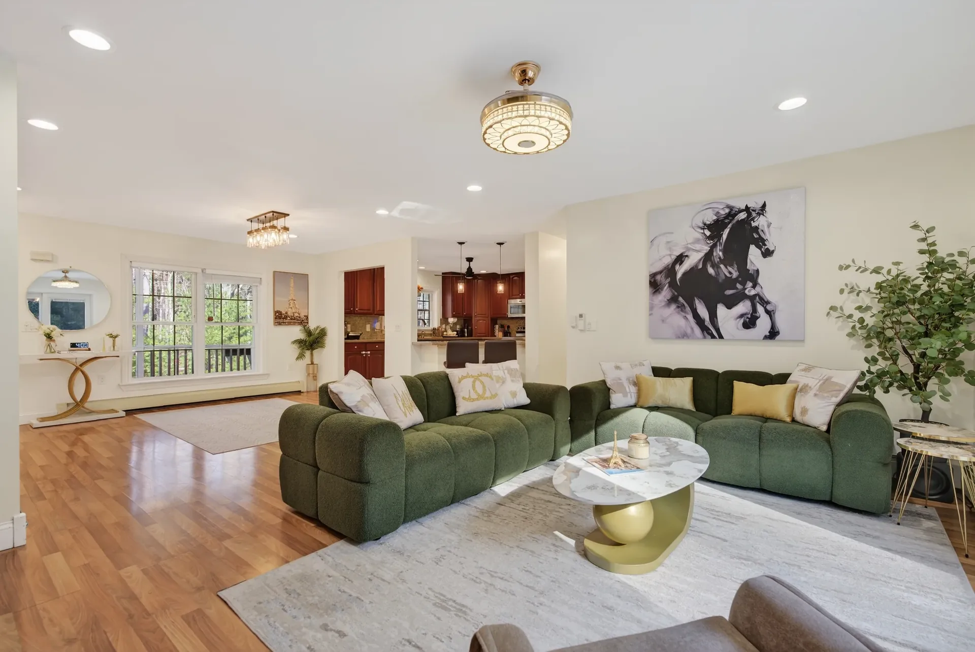 Living room staged — open flow to kitchen