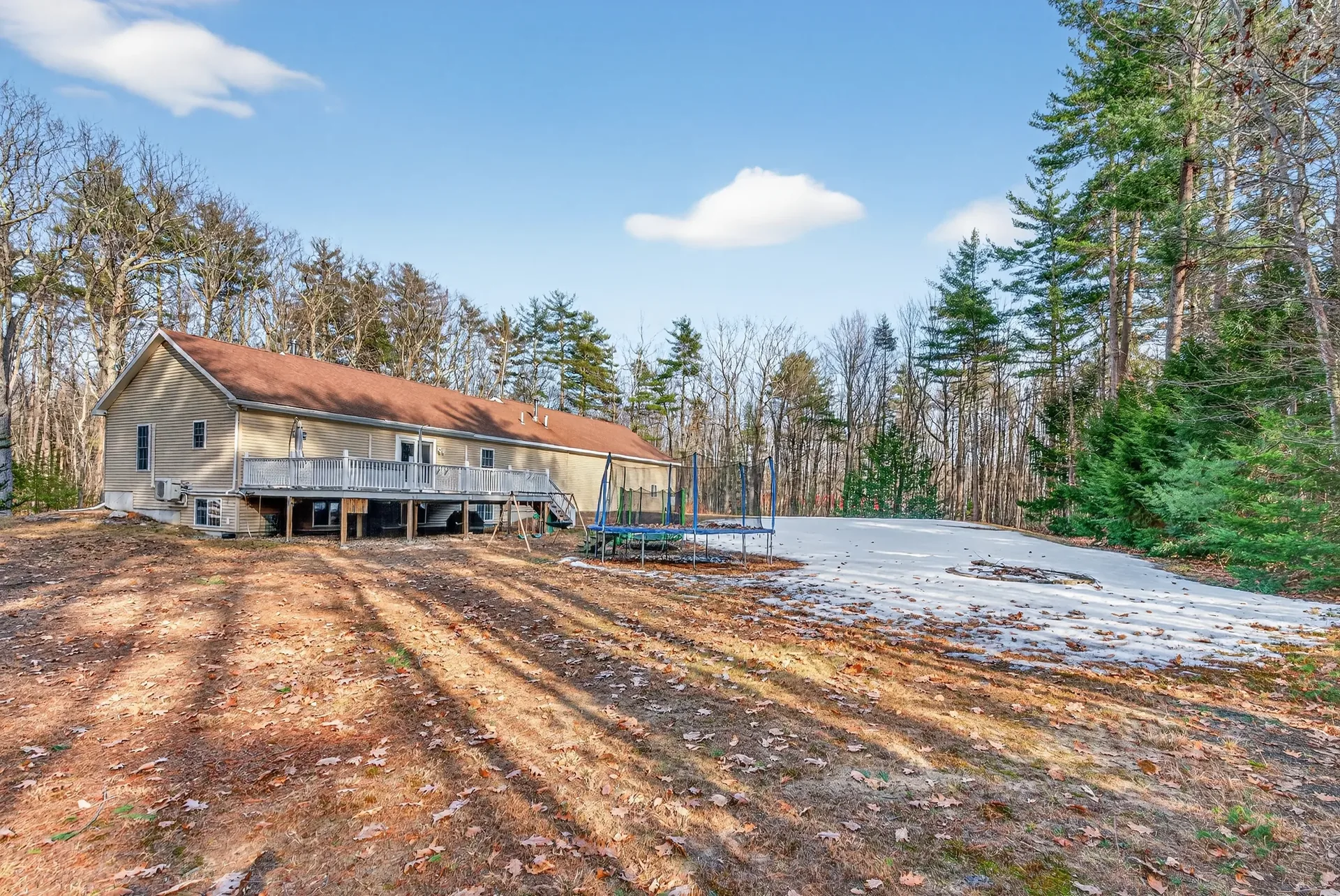 Back of house with deck and yard